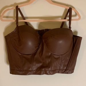 Brown cropped corset top.Tried on once. Zip up. Non stretchy. Adjustable straps.